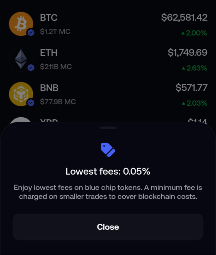 Fomo app screen advertising lowest fees of 0.05% on blue chip tokens like BTC, ETH, and BNB